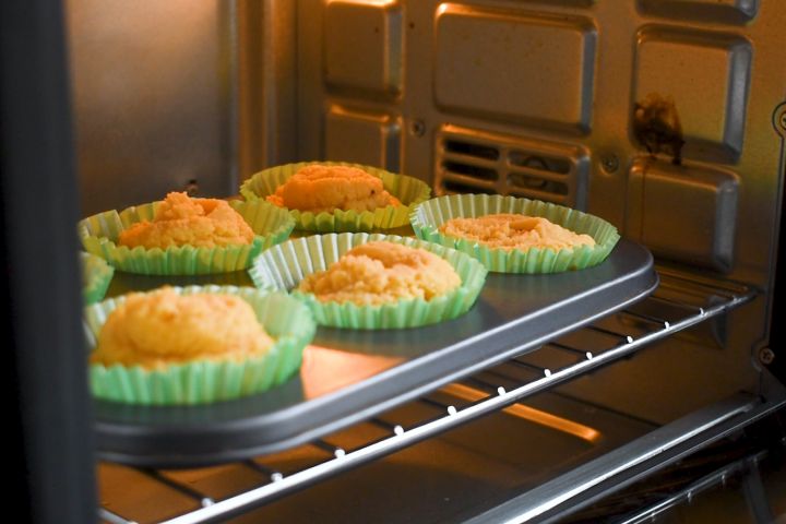 Coconut muffins baking in the oven. 