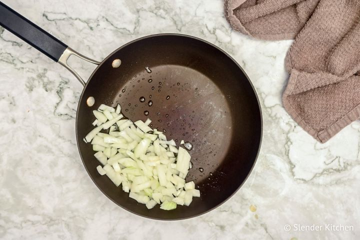 Onions in a skillet with butter.