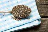 Chia seeds on a spoon on a table