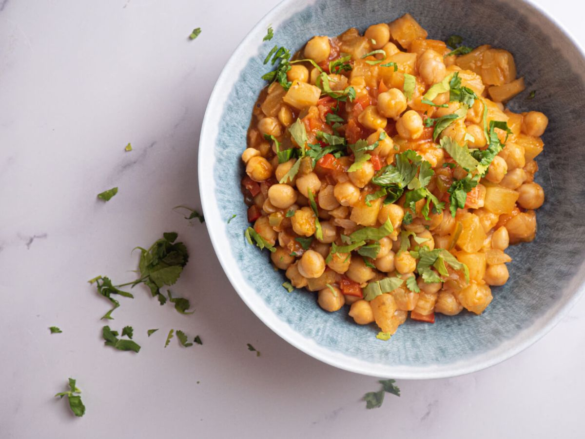 Sweet and Sour Chickpeas with Pineapple Served in a Round Bowl.