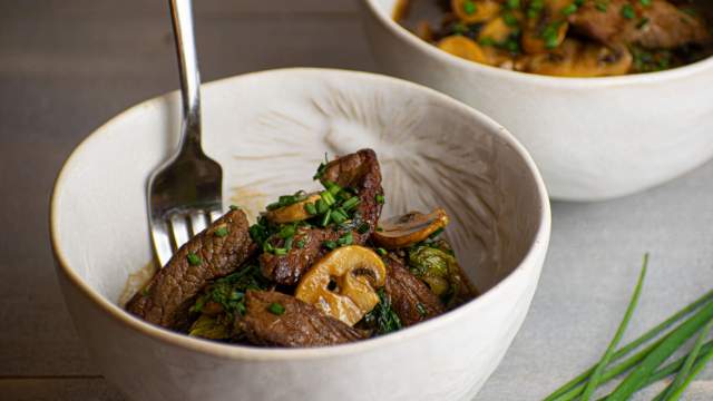 Beef boy choy stir fry with mushrooms and green onions in a soy stir fry sauce.