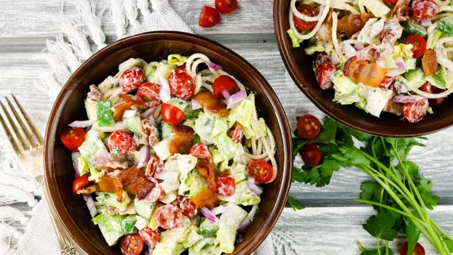 BLT Pasta salad with lettuce, tomatoes, bacon, and spaghetti in a bowl with ranch dressing.