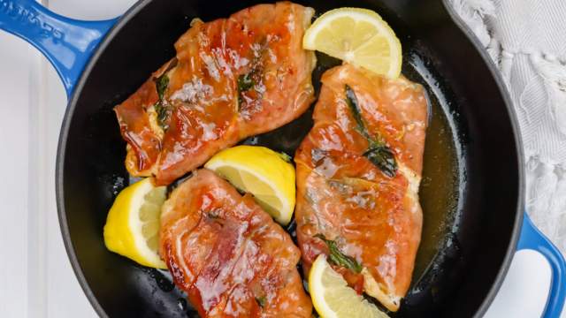 Chicken Saltimbocca with prosciutto and sage in a cast iron skillet.