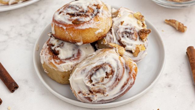 Easy cinnamon rolls made with two ingredient dough and topped with cream cheese glaze and cinnamon.